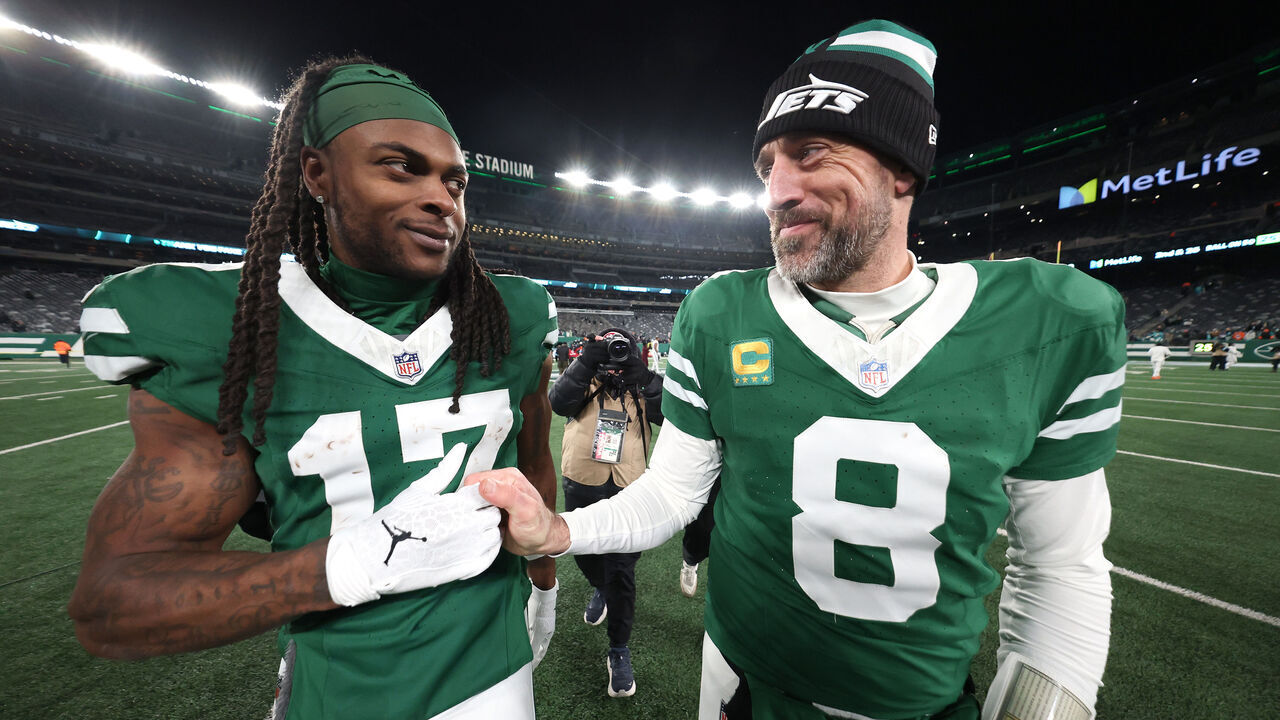 EAST RUTHERFORD, NEW JERSEY - JANUARY 05: Aaron Rodgers #8 and Davante Adams #17 of the New York Jets embrace after beating the Miami Dolphins 32-20 at MetLife Stadium on January 05, 2025 in East Rutherford, New Jersey.