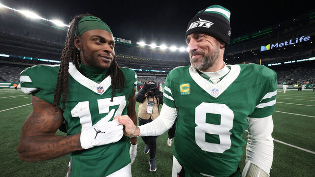 EAST RUTHERFORD, NEW JERSEY - JANUARY 05: Aaron Rodgers #8 and Davante Adams #17 of the New York Jets embrace after beating the Miami Dolphins 32-20 at MetLife Stadium on January 05, 2025 in East Rutherford, New Jersey.