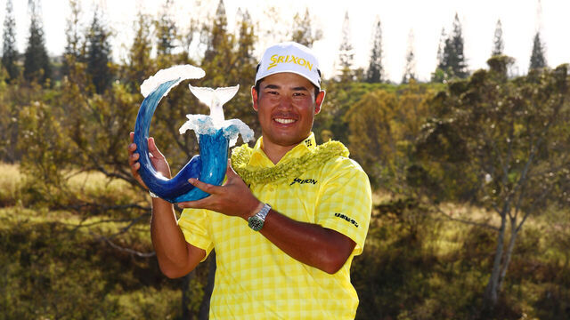KAPALUA, HAWAII - JANUARY 05: Hideki Matsuyama of Japan poses with the trophy after winning The Sentry 2025 at Plantation Course at Kapalua Golf Club on January 05, 2025 in Kapalua, Hawaii. Matsuyama sets the PGA TOUR record for lowest 72-hole score to par with -35.