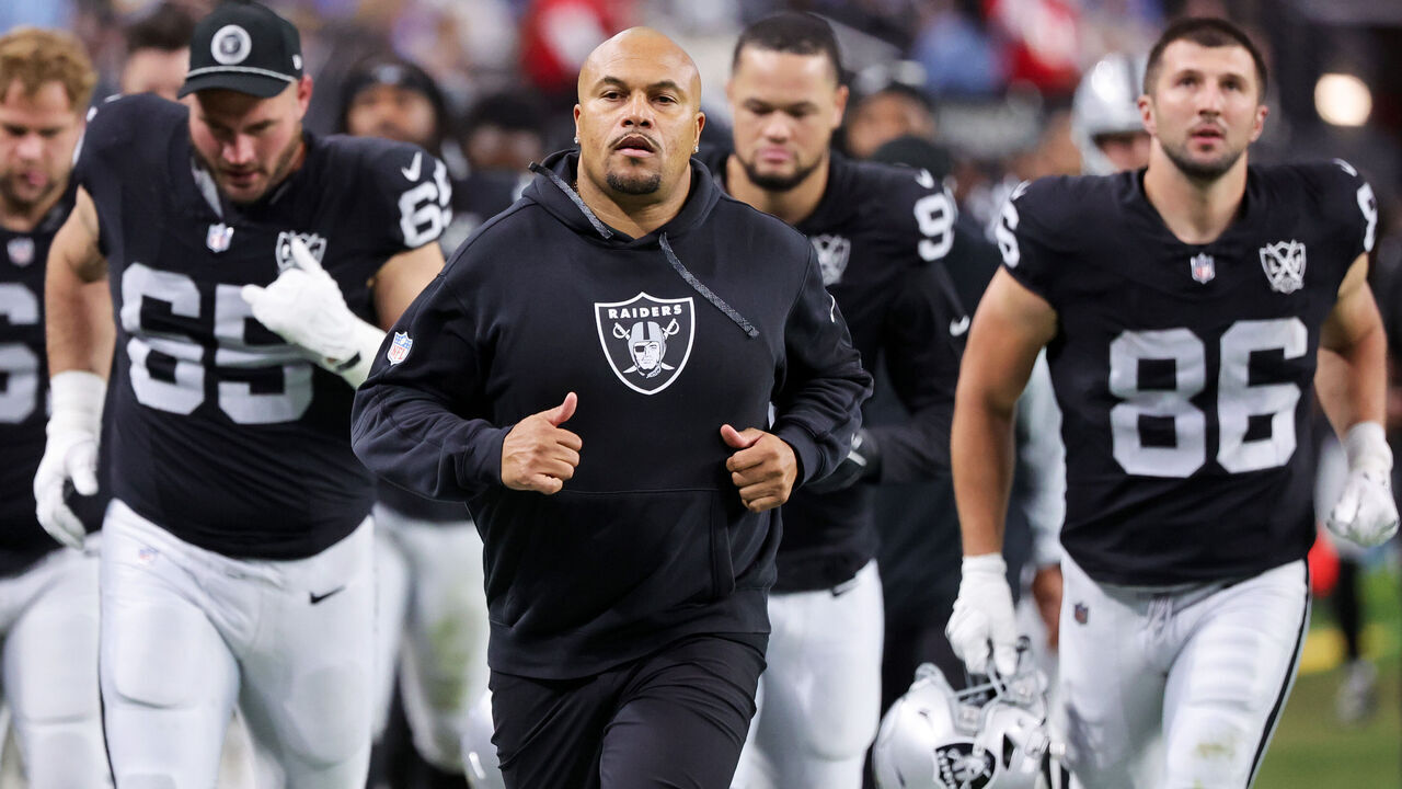 LAS VEGAS, NEVADA - JANUARY 05: Cody Whitehair #65, head coach Antonio Pierce and John Samuel Shenker #86 of the Las Vegas Raiders leave the field at halftime of a game against the Los Angeles Chargers at Allegiant Stadium on January 05, 2025 in Las Vegas, Nevada. The Chargers defeated the Raiders 34-20.
