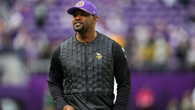 MINNEAPOLIS, MINNESOTA - DECEMBER 29: Defensive coordinator Brian Flores of the Minnesota Vikings looks on prior to a game between the Minnesota Vikings and Green Bay Packers at U.S. Bank Stadium on December 29, 2024 in Minneapolis, Minnesota.