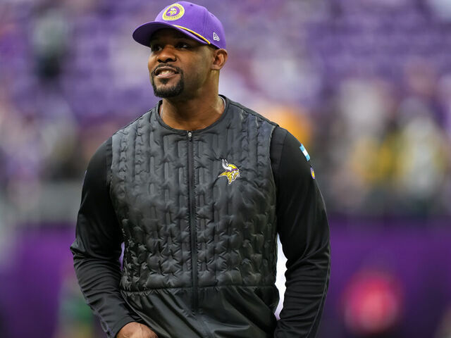 MINNEAPOLIS, MINNESOTA - DECEMBER 29: Defensive coordinator Brian Flores of the Minnesota Vikings looks on prior to a game between the Minnesota Vikings and Green Bay Packers at U.S. Bank Stadium on December 29, 2024 in Minneapolis, Minnesota.