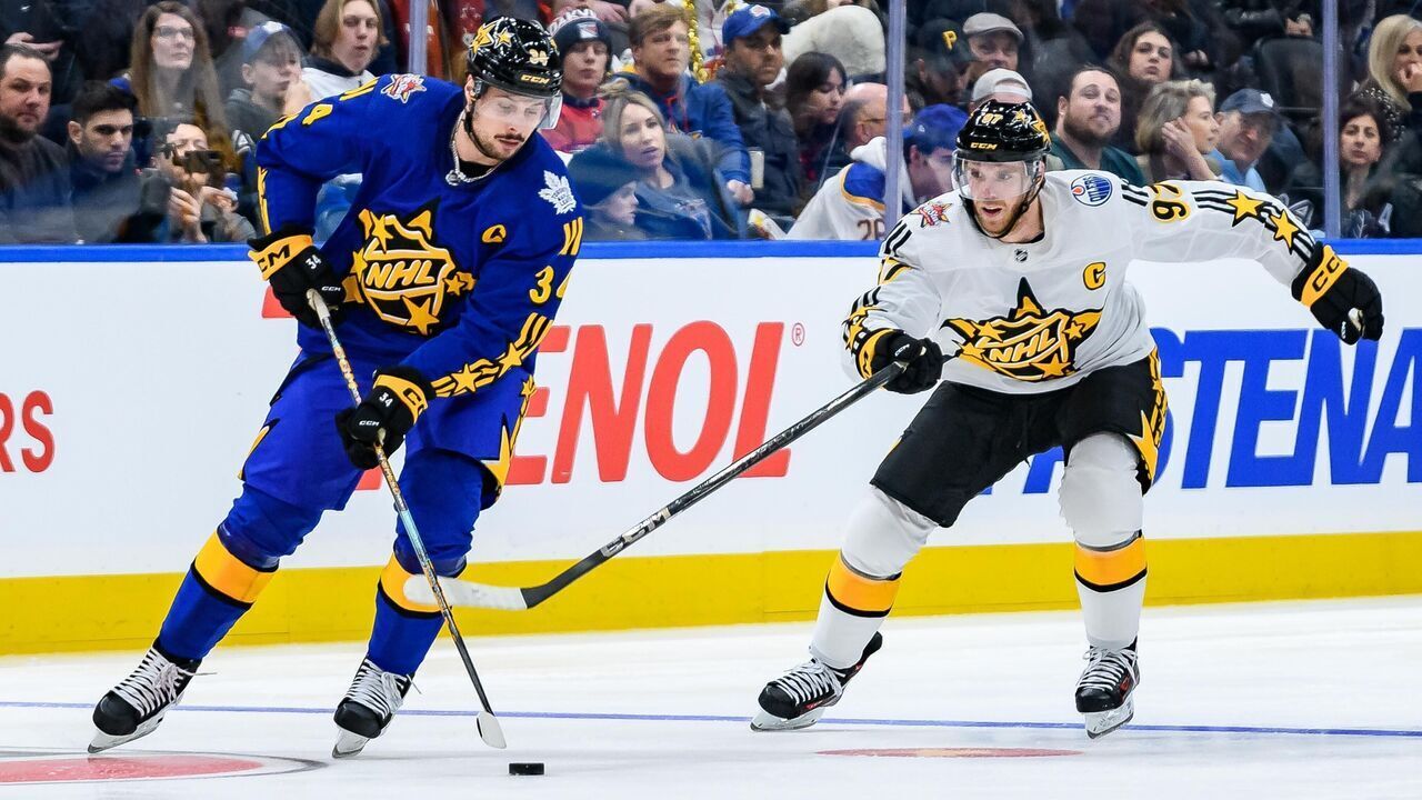 TORONTO, ON - FEBRUARY 03: Toronto Maple Leafs Center Auston Matthews (34) skates with the puck away from Edmonton Oilers Center Connor McDavid (97) during the third and final game of the 2024 NHL All-Star game at Scotiabank Arena on February 03, 2024 in Toronto, Ontario, Canada.
