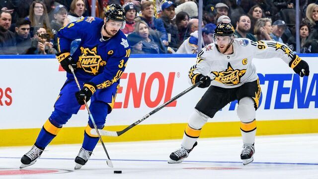 TORONTO, ON - FEBRUARY 03: Toronto Maple Leafs Center Auston Matthews (34) skates with the puck away from Edmonton Oilers Center Connor McDavid (97) during the third and final game of the 2024 NHL All-Star game at Scotiabank Arena on February 03, 2024 in Toronto, Ontario, Canada.