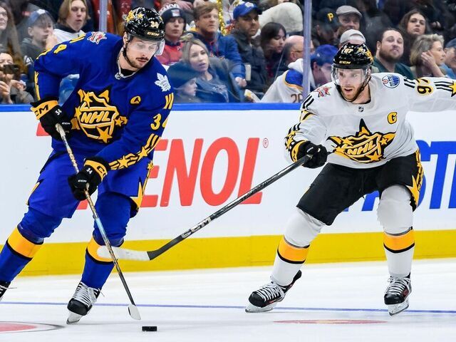 TORONTO, ON - FEBRUARY 03: Toronto Maple Leafs Center Auston Matthews (34) skates with the puck away from Edmonton Oilers Center Connor McDavid (97) during the third and final game of the 2024 NHL All-Star game at Scotiabank Arena on February 03, 2024 in Toronto, Ontario, Canada.