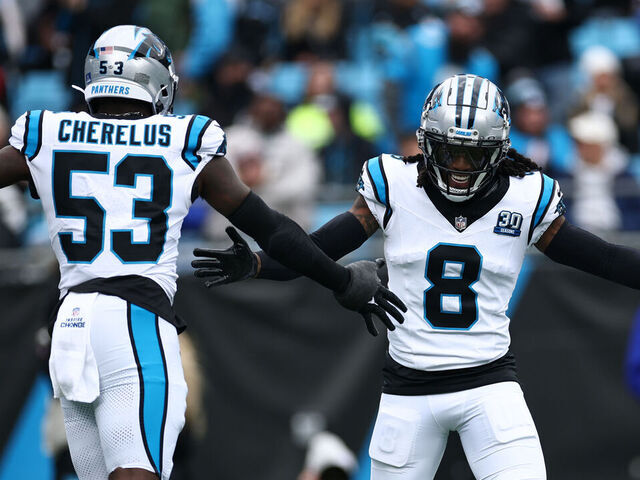 CHARLOTTE, NORTH CAROLINA - DECEMBER 15: Jaycee Horn #8 of the Carolina Panthers celebrates with teammate Claudin Cherelus #53 after a sack against the Dallas Cowboys during the first quarter at Bank of America Stadium on December 15, 2024 in Charlotte, North Carolina.