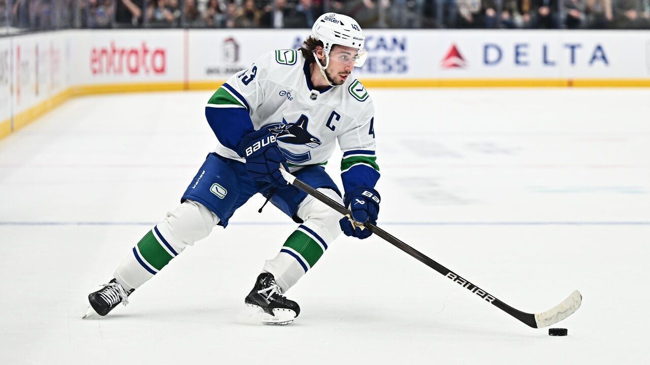 SALT LAKE CITY, UTAH - DECEMBER 18: Quinn Hughes #43 of the Vancouver Canucks skates against the Utah Hockey Club on December 18, 2024 at Delta Center in Salt Lake City, Utah.