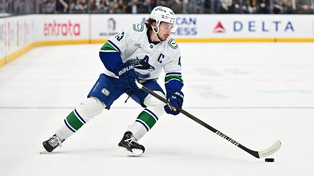 SALT LAKE CITY, UTAH - DECEMBER 18: Quinn Hughes #43 of the Vancouver Canucks skates against the Utah Hockey Club on December 18, 2024 at Delta Center in Salt Lake City, Utah.
