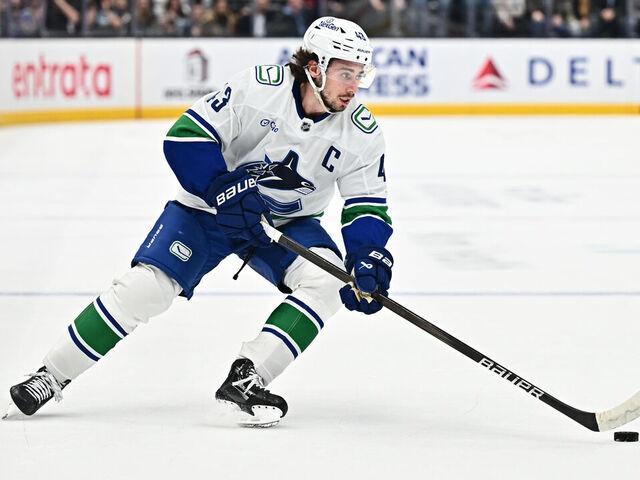 SALT LAKE CITY, UTAH - DECEMBER 18: Quinn Hughes #43 of the Vancouver Canucks skates against the Utah Hockey Club on December 18, 2024 at Delta Center in Salt Lake City, Utah.