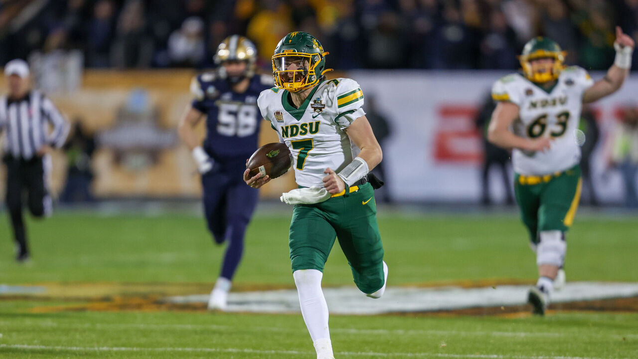 FRISCO, TX - JANUARY 06: North Dakota State Bison quarterback Cam Miller (7) runs to the end zone for a touchdown during the FCS Championship game between North Dakota State and Montana State on January 6, 2025 at Toyota Stadium in Frisco, TX.