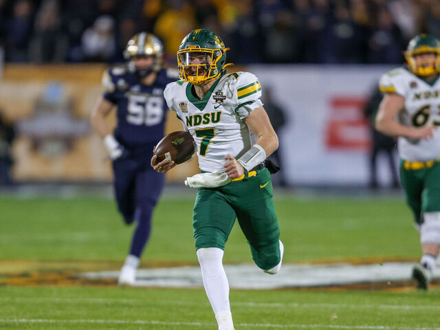 FRISCO, TX - JANUARY 06: North Dakota State Bison quarterback Cam Miller (7) runs to the end zone for a touchdown during the FCS Championship game between North Dakota State and Montana State on January 6, 2025 at Toyota Stadium in Frisco, TX.