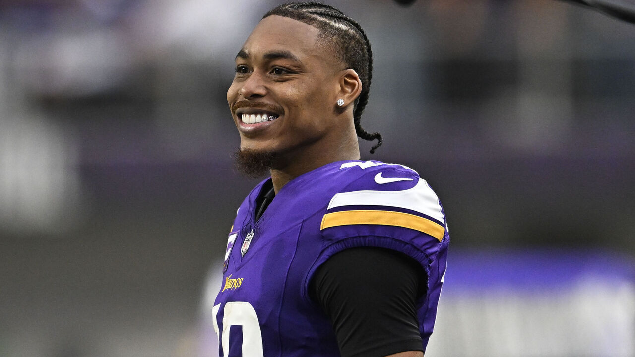 MINNEAPOLIS, MINNESOTA - DECEMBER 8: Justin Jefferson #18 of the Minnesota Vikings looks on from the bench in the fourth quarter of the game against the Atlanta Falcons at U.S. Bank Stadium on December 8, 2024 in Minneapolis, Minnesota. The Vikings defeated the Falcons 42-21.