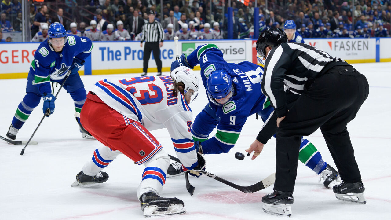 VANCOUVER, CANADA - OCTOBER 28: Mika Zibanejad #93 of the New York Rangers faces off against J.T. Miller #9 of the Vancouver Canucks during the first period of their NHL game at Rogers Arena on October 28, 2023 in Vancouver, British Columbia, Canada.