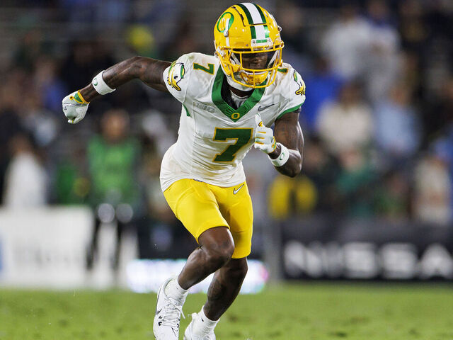 PASADENA, CA - SEPTEMBER 28: Wide receiver Evan Stewart #7 of the Oregon Ducks gets set during the second quarter of an NCAA college football game against the UCLA Bruins, at Rose Bowl on September 28, 2024 in Pasadena, California.
