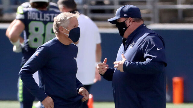 SEATTLE, WASHINGTON - SEPTEMBER 27: (L-R) Head coach Pete Carroll of the Seattle Seahawks and head coach Mike McCarthy of the Dallas Cowboys talk prior to the game at CenturyLink Field on September 27, 2020 in Seattle, Washington.