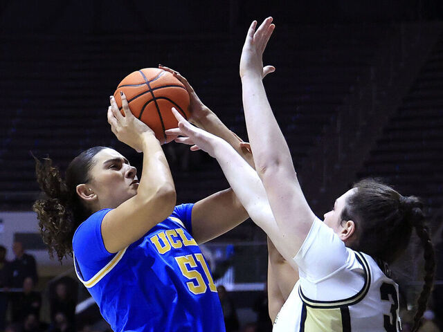 WEST LAFAYETTE, INDIANA - JANUARY 07: Lauren Betts #51 of the UCLA Bruins takes a shot over Lana McCarthy #35 of the Purdue Boilermakers during the second half at Mackey Arena on January 07, 2025 in West Lafayette, Indiana.