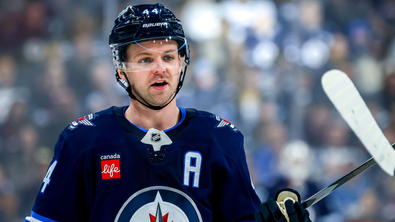 WINNIPEG, CANADA - DECEMBER 30: Josh Morrissey #44 of the Winnipeg Jets looks on during a second period stoppage of play against the Nashville Predators at Canada Life Centre on December 30, 2024 in Winnipeg, Manitoba, Canada.