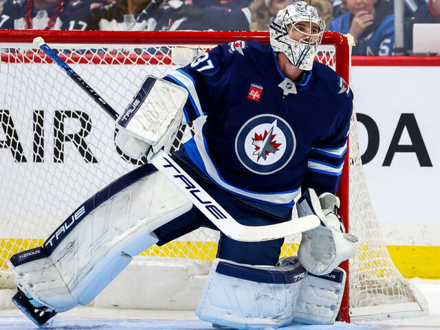 WINNIPEG, CANADA - JANUARY 4: Goaltender Connor Hellebuyck #37 of the Winnipeg Jets guards the net during second period action against the Detroit Red Wings at the Canada Life Centre on January 4, 2025 in Winnipeg, Manitoba, Canada.