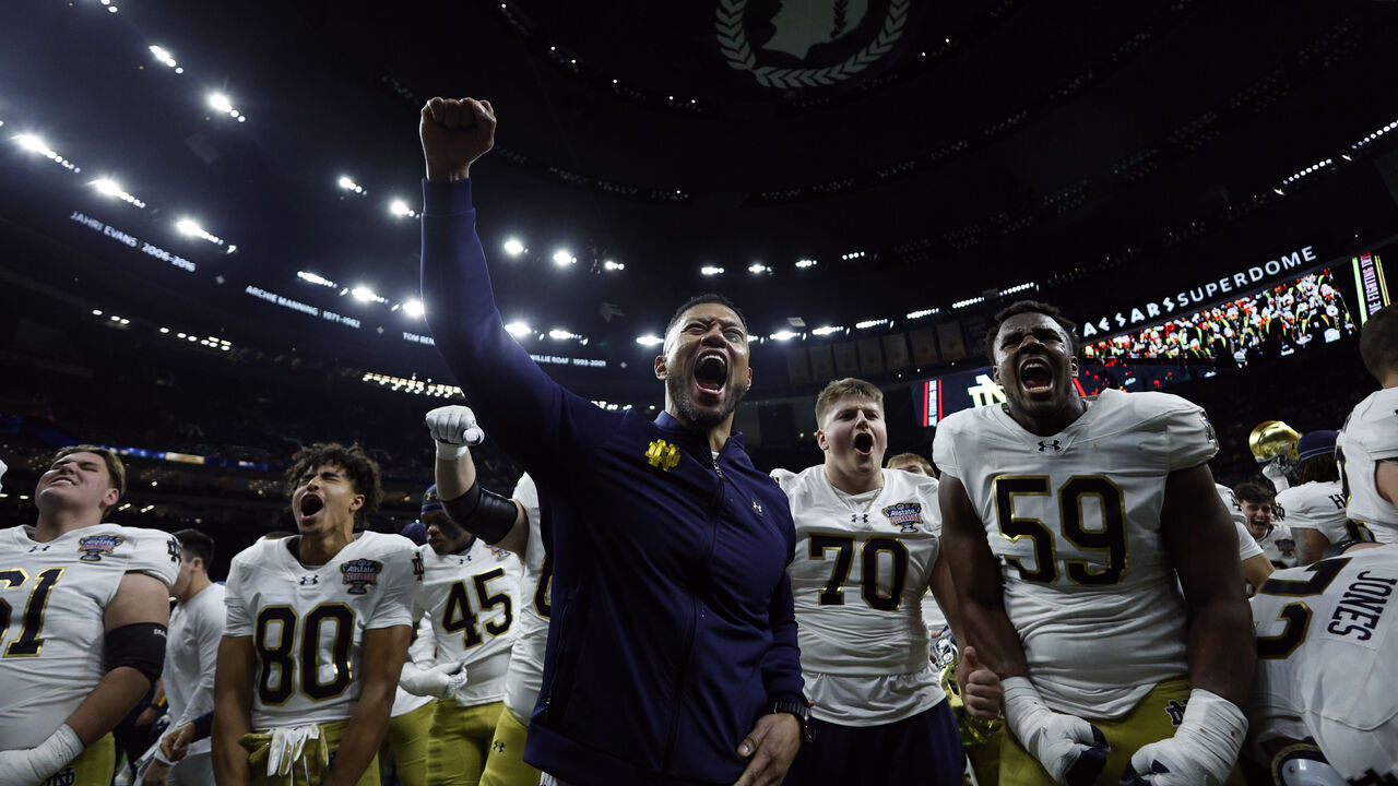 NEW ORLEANS, LOUISIANA - JANUARY 02: Head coach Marcus Freeman of the Notre Dame Fighting Irish celebrates with his team after a 23-10 victory against the Georgia Bulldogs in the 91st Allstate Sugar Bowl at Caesars Superdome on January 02, 2025 in New Orleans, Louisiana.