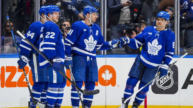 TORONTO, ON - DECEMBER 31: John Tavares #91 of the Toronto Maple Leafs celebrates scoring a goal with Jake McCabe #22; William Nylander and Morgan Rielly #44 during the third period against the New York Islanders at the Scotiabank Arena on December 31, 2024 in Toronto, Ontario, Canada.