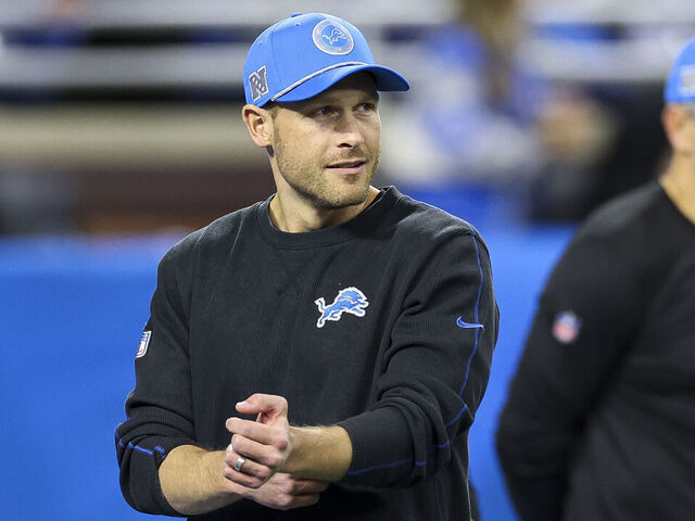 DETROIT, MICHIGAN - NOVEMBER 28: Offensive coordinator Ben Johnson of the Detroit Lions looks on before a game against the Chicago Bears at Ford Field on November 28, 2024 in Detroit, Michigan.