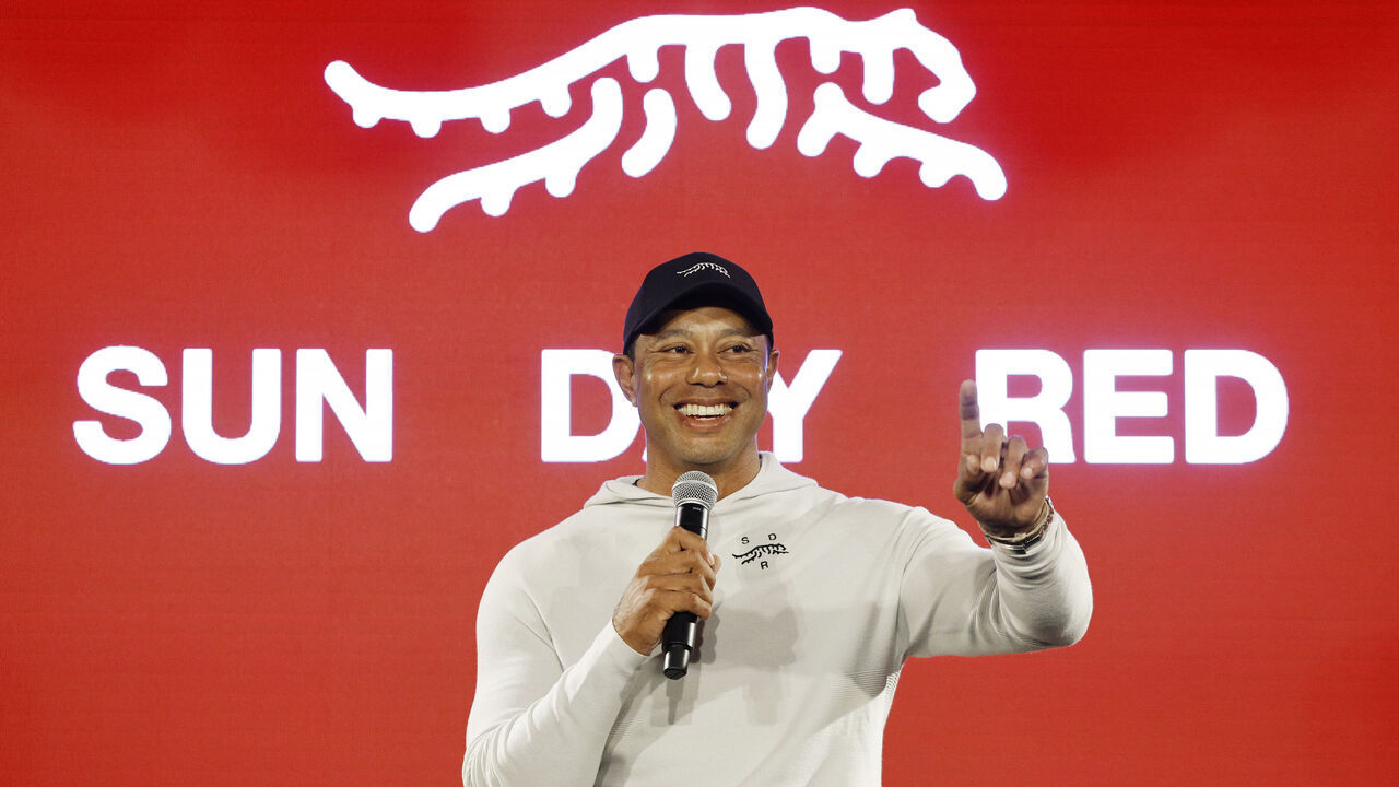 PACIFIC PALISADES, CALIFORNIA - FEBRUARY 12: Tiger Woods speaks during the launch of Tiger Woods and TaylorMade Golf's new apparel and footwear brand "Sun Day Red" at Palisades Village on February 12, 2024 in Pacific Palisades, California.