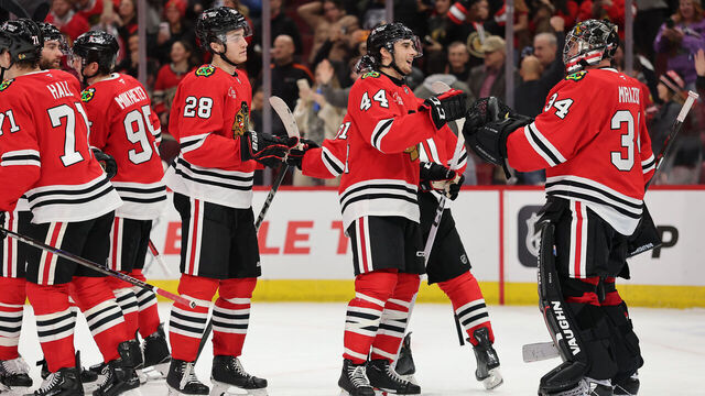 CHICAGO, ILLINOIS - JANUARY 08: Petr Mrazek #34 of the Chicago Blackhawks celebrates with teammates after defeating the Colorado Avalanche during the third period at the United Center on January 08, 2025 in Chicago, Illinois.