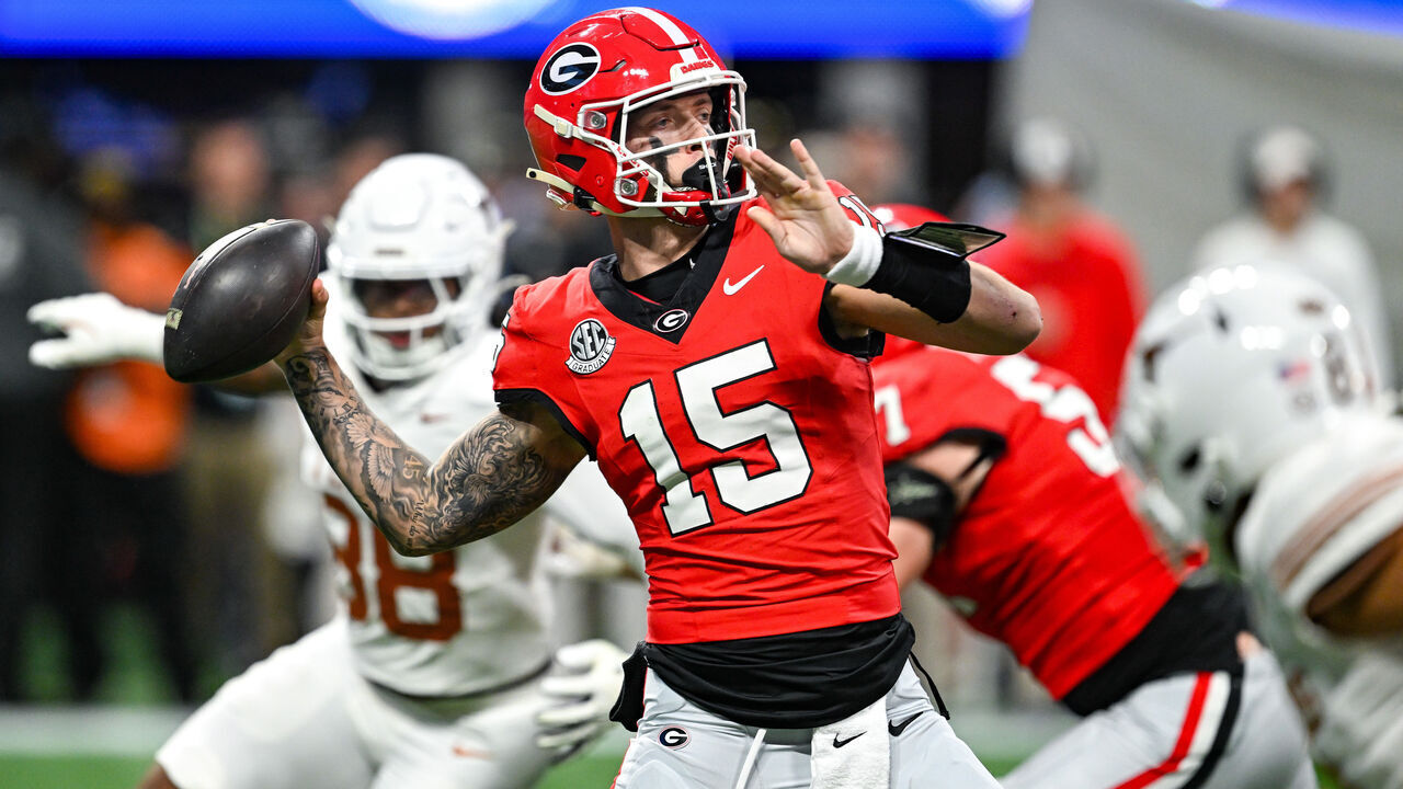 ATLANTA, GA DECEMBER 07: Georgia quarterback Carson Beck (15) drops back to pass during the SEC Championship game between the Texas Longhorns and the Georgia Bulldogs on December 7th, 2024 at Mercedes-Benz Stadium in Atlanta, GA.