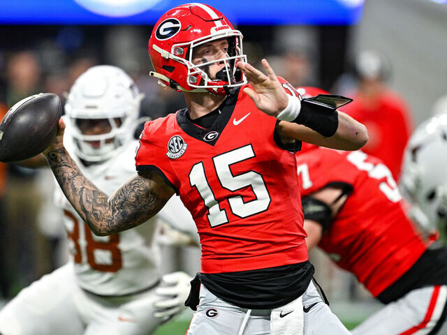 ATLANTA, GA DECEMBER 07: Georgia quarterback Carson Beck (15) drops back to pass during the SEC Championship game between the Texas Longhorns and the Georgia Bulldogs on December 7th, 2024 at Mercedes-Benz Stadium in Atlanta, GA.