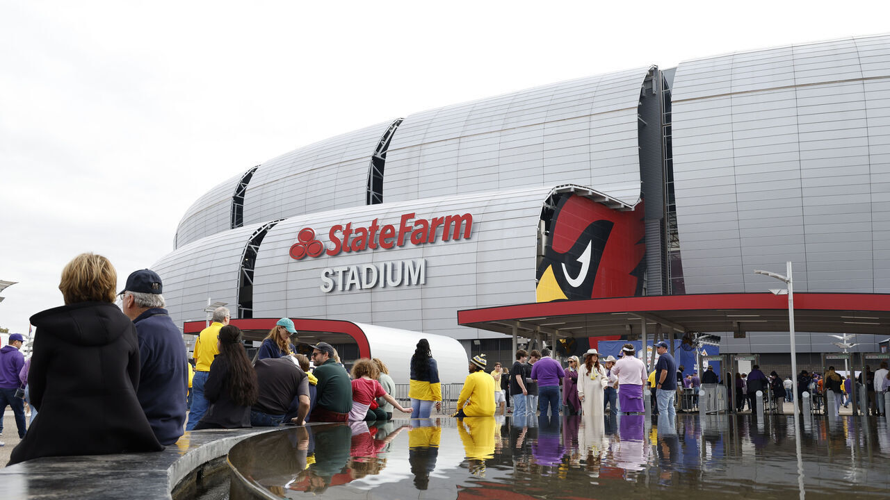 GLENDALE, ARIZONA - DECEMBER 31: Fans are seen outside the stadium prior to the game between the Michigan Wolverines and the TCU Horned Frogs in the Vrbo Fiesta Bowl at State Farm Stadium on December 31, 2022 in Glendale, Arizona.