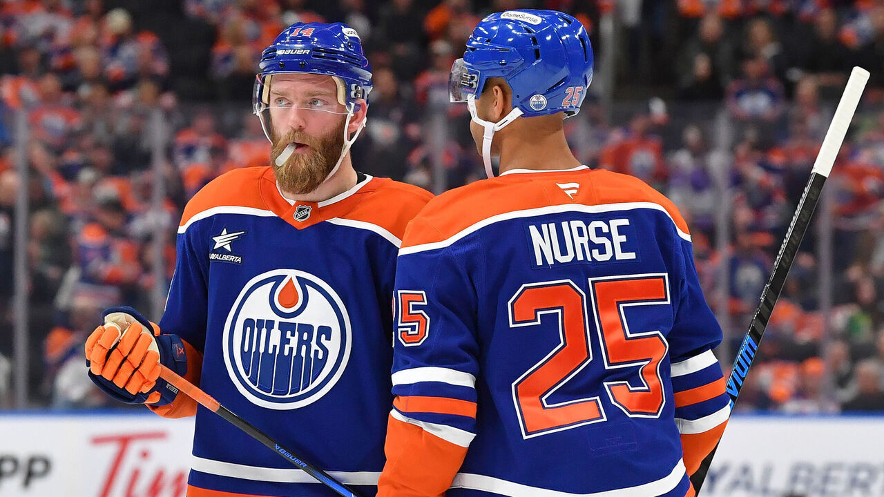 EDMONTON, CANADA - NOVEMBER 14: Mattias Ekholm #14 and Darnell Nurse #25 have a conversation during a stoppage in play in the the game against the Nashville Predators at Rogers Place on November 14, 2024, in Edmonton, Alberta, Canada.