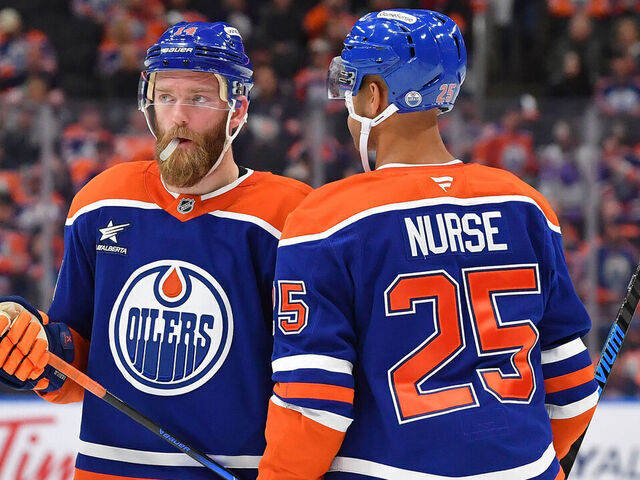 EDMONTON, CANADA - NOVEMBER 14: Mattias Ekholm #14 and Darnell Nurse #25 have a conversation during a stoppage in play in the the game against the Nashville Predators at Rogers Place on November 14, 2024, in Edmonton, Alberta, Canada.