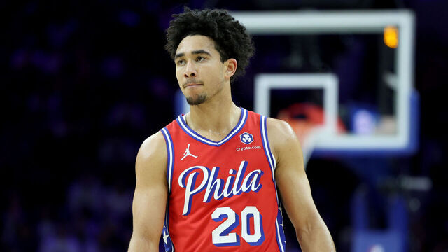PHILADELPHIA, PENNSYLVANIA - DECEMBER 13: Jared McCain #20 of the Philadelphia 76ers looks on during a game against the Indiana Pacers at the Wells Fargo Center on December 13, 2024 in Philadelphia, Pennsylvania.