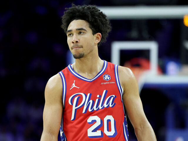 PHILADELPHIA, PENNSYLVANIA - DECEMBER 13: Jared McCain #20 of the Philadelphia 76ers looks on during a game against the Indiana Pacers at the Wells Fargo Center on December 13, 2024 in Philadelphia, Pennsylvania.