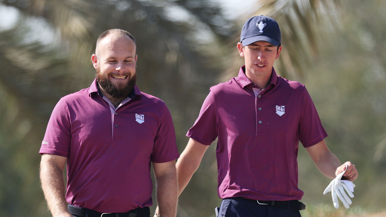 ABU DHABI, UNITED ARAB EMIRATES - JANUARY 10: Tyrrell Hatton and Tom McKibbin of Team Great Britain & Ireland talk as they walk to the 11th tee of Team Great Britain & Ireland during fourballs on day one of the Team Cup at Abu Dhabi Golf Resort on January 10, 2025 in Abu Dhabi, United Arab Emirates.