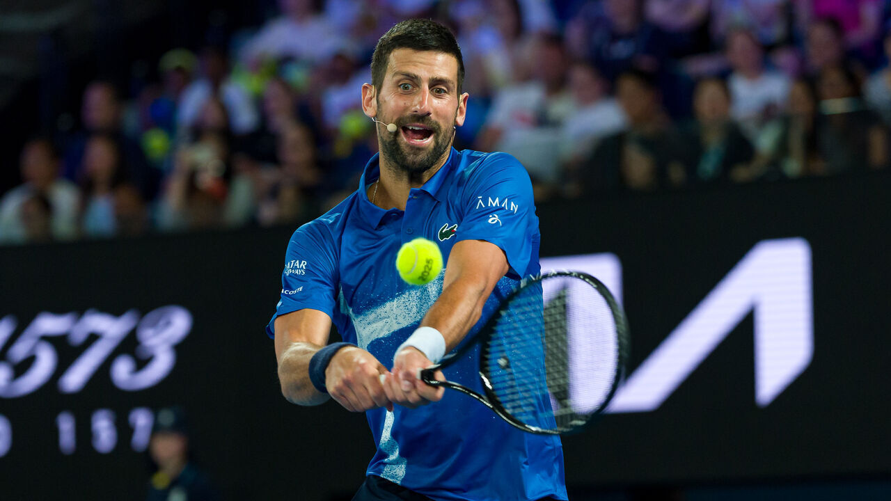 MELBOURNE, AUSTRALIA - JANUARY 09: Novak Djokovic of Serbia plays a backhand in the Mixed Doubles match with Qinwen Zheng of China against Andy Murray of Great Britain and Victoria Azarenka during the Night with Novak charity event ahead of the 2025 Australian Open at Melbourne Park on January 09, 2025 in Melbourne, Australia.