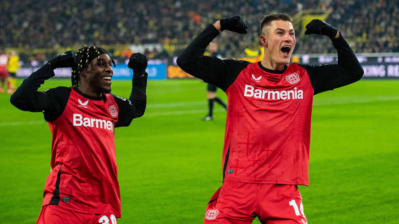 DORTMUND, GERMANY - JANUARY 10: Patrik Schick (R) of Leverkusen celebrates after scoring his team's second goal with Jeremie Frimpong (L) of Leverkusen during the Bundesliga match between Borussia Dortmund and Bayer Leverkusen at the Signal Iduna Park on January 10, 2025 in Dortmund, Germany.