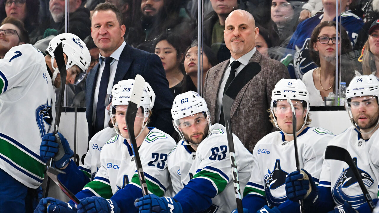 MONTREAL, CANADA - JANUARY 06: (L-R) Assistant coach Adam Foote and head coach Rick Tocchet of the Vancouver Canucks handle bench duties during the first period against the Montreal Canadiens at the Bell Centre on January 6, 2025 in Montreal, Quebec, Canada. The Montreal Canadiens defeated the Vancouver Canucks 5-4 in overtime.