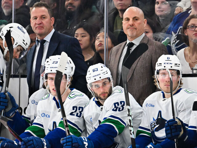 MONTREAL, CANADA - JANUARY 06: (L-R) Assistant coach Adam Foote and head coach Rick Tocchet of the Vancouver Canucks handle bench duties during the first period against the Montreal Canadiens at the Bell Centre on January 6, 2025 in Montreal, Quebec, Canada. The Montreal Canadiens defeated the Vancouver Canucks 5-4 in overtime.