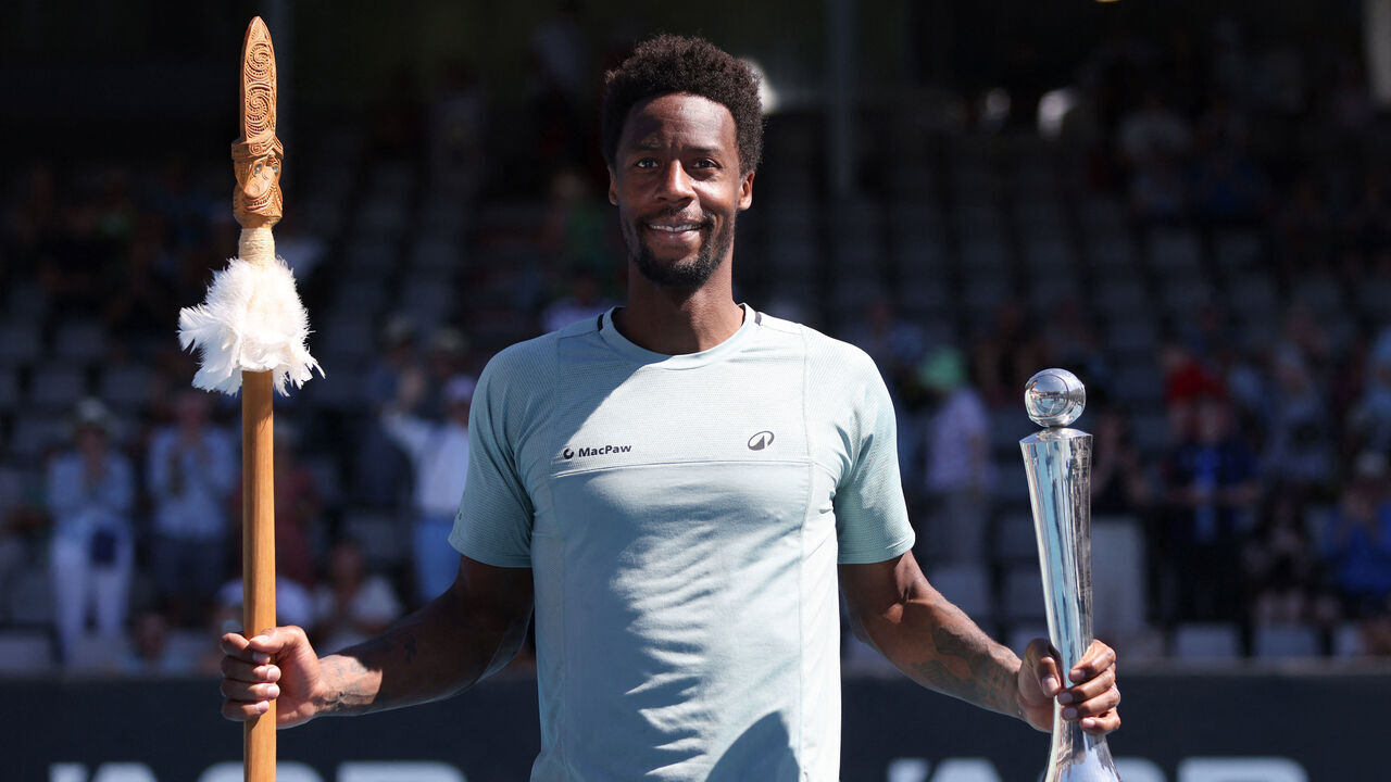 Gael Monfils of France poses with the trophy as he celebrates his win over Zizou Berges of Belgium following their men's singles final match at the ATP Auckland Classic tennis tournament in Auckland on January 11, 2025.