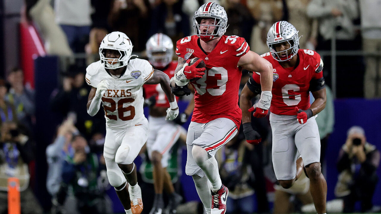 ARLINGTON, TEXAS - JANUARY 10: Jack Sawyer #33 of the Ohio State Buckeyes runs with the ball after recovering a fumble in the fourth quarter against the Texas Longhorns during the Goodyear Cotton Bowl at AT&T Stadium on January 10, 2025 in Arlington, Texas.