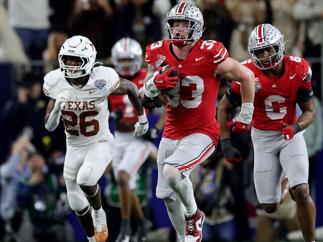 ARLINGTON, TEXAS - JANUARY 10: Jack Sawyer #33 of the Ohio State Buckeyes runs with the ball after recovering a fumble in the fourth quarter against the Texas Longhorns during the Goodyear Cotton Bowl at AT&T Stadium on January 10, 2025 in Arlington, Texas.