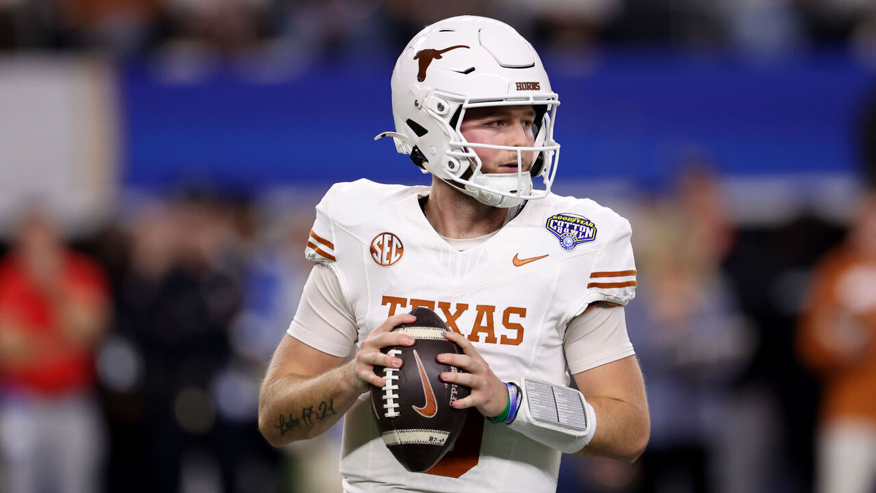 ARLINGTON, TEXAS - JANUARY 10: Quinn Ewers #3 of the Texas Longhorns drops back to pass in the first quarter against the Ohio State Buckeyes during the Goodyear Cotton Bowl at AT&T Stadium on January 10, 2025 in Arlington, Texas.