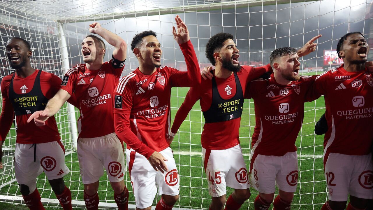 Brest's players celebrates their victory at the end of the French L1 football match between Stade Brestois 29 (Brest) and Olympique Lyonnais (OL) at Stade Francis-Le Ble in Brest, western France on January 11, 2025.