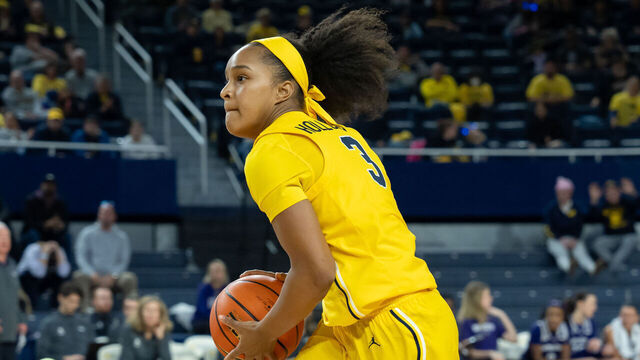 ANN ARBOR, MICHIGAN - DECEMBER 8: Mila Holloway #3 of the Michigan Wolverines looks to pass during the third quarter against the Northwestern Wildcats at Crisler Arena on December 8, 2024 in Ann Arbor, Michigan.