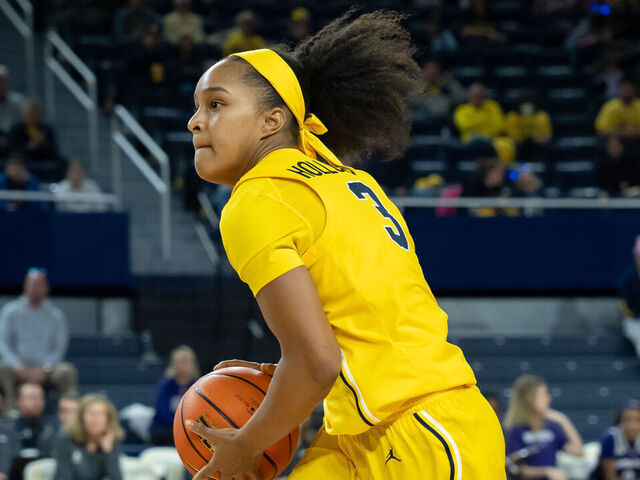 ANN ARBOR, MICHIGAN - DECEMBER 8: Mila Holloway #3 of the Michigan Wolverines looks to pass during the third quarter against the Northwestern Wildcats at Crisler Arena on December 8, 2024 in Ann Arbor, Michigan.