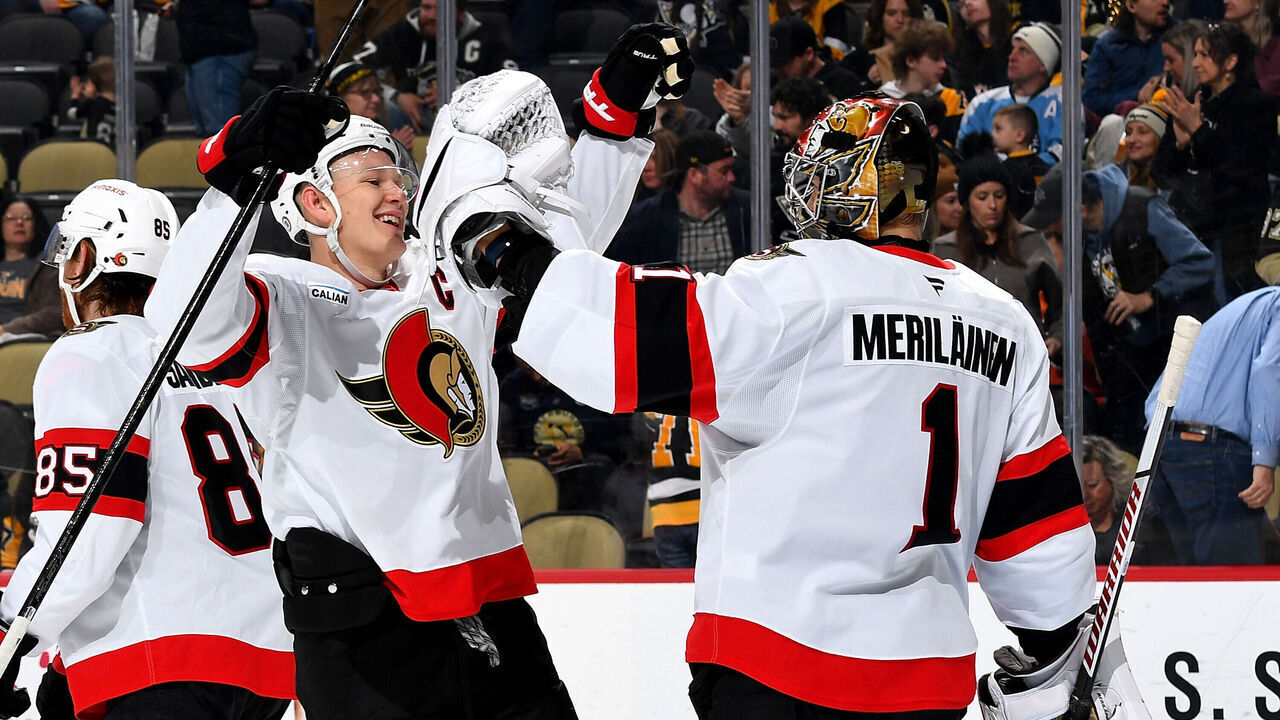 PITTSBURGH, PA - JANUARY 11: Leevi Merilainen #1 celebrates with Brady Tkachuk #7 of the Ottawa Senators after defeating the Pittsburgh Penguins at PPG PAINTS Arena on January11, 2025 in Pittsburgh, Pennsylvania.