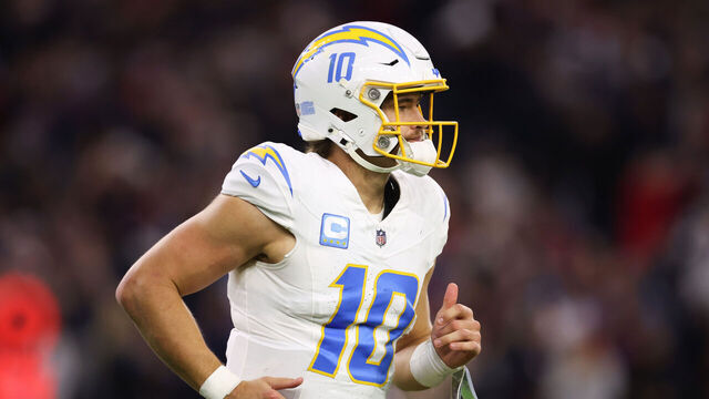 HOUSTON, TEXAS - JANUARY 11: Justin Herbert #10 of the Los Angeles Chargers reacts after throwing an interception against the Houston Texans in the third quarter during the AFC Wild Card Playoffs at NRG Stadium on January 11, 2025 in Houston, Texas.