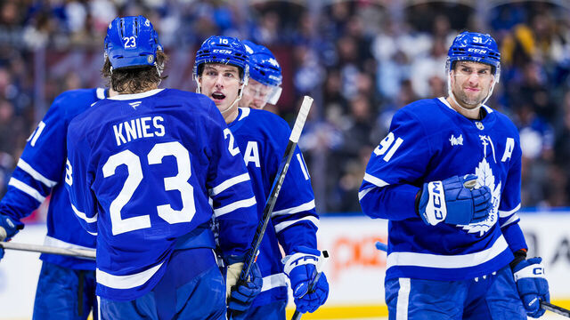 TORONTO, ON - JANUARY 11: Mitch Marner #16 and Matthew Knies #23 of the Toronto Maple Leafs interact in between plays during the third period against the Vancouver Canucks at the Scotiabank Arena on January 11, 2025 in Toronto, Ontario, Canada.