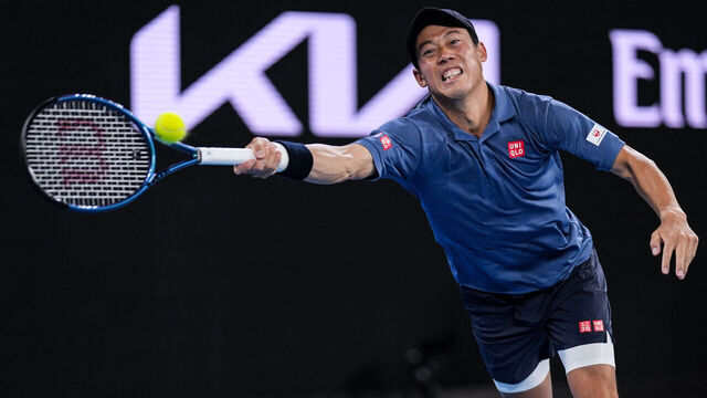 MELBOURNE, AUSTRALIA - JANUARY 12: Kei Nishikori of Japan plays a forehand in the Men's Singles First Round match against Thiago Monteiro of Brazil during day one of the 2025 Australian Open at Melbourne Park on January 12, 2025 in Melbourne, Australia.